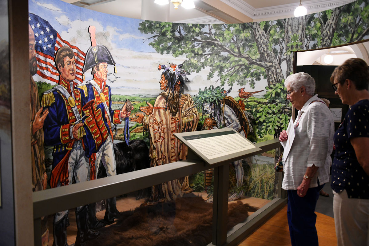 077 Judy Sullivan and Nancy Heinrichs read about the treaty with the Indians.JPG